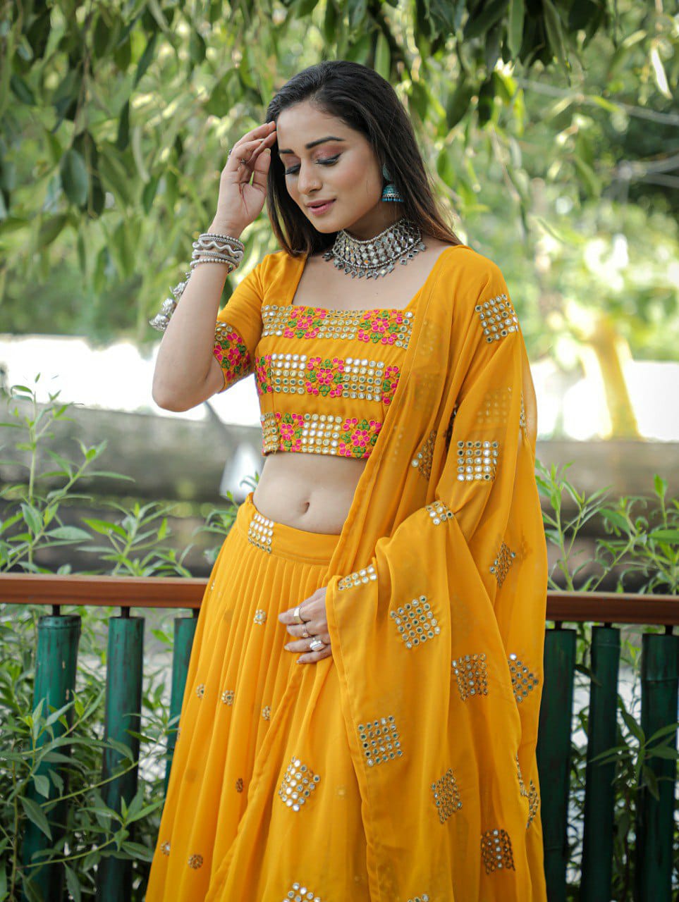 Mustered Embroidered Faux Georgette Party Wear Lehenga Choli