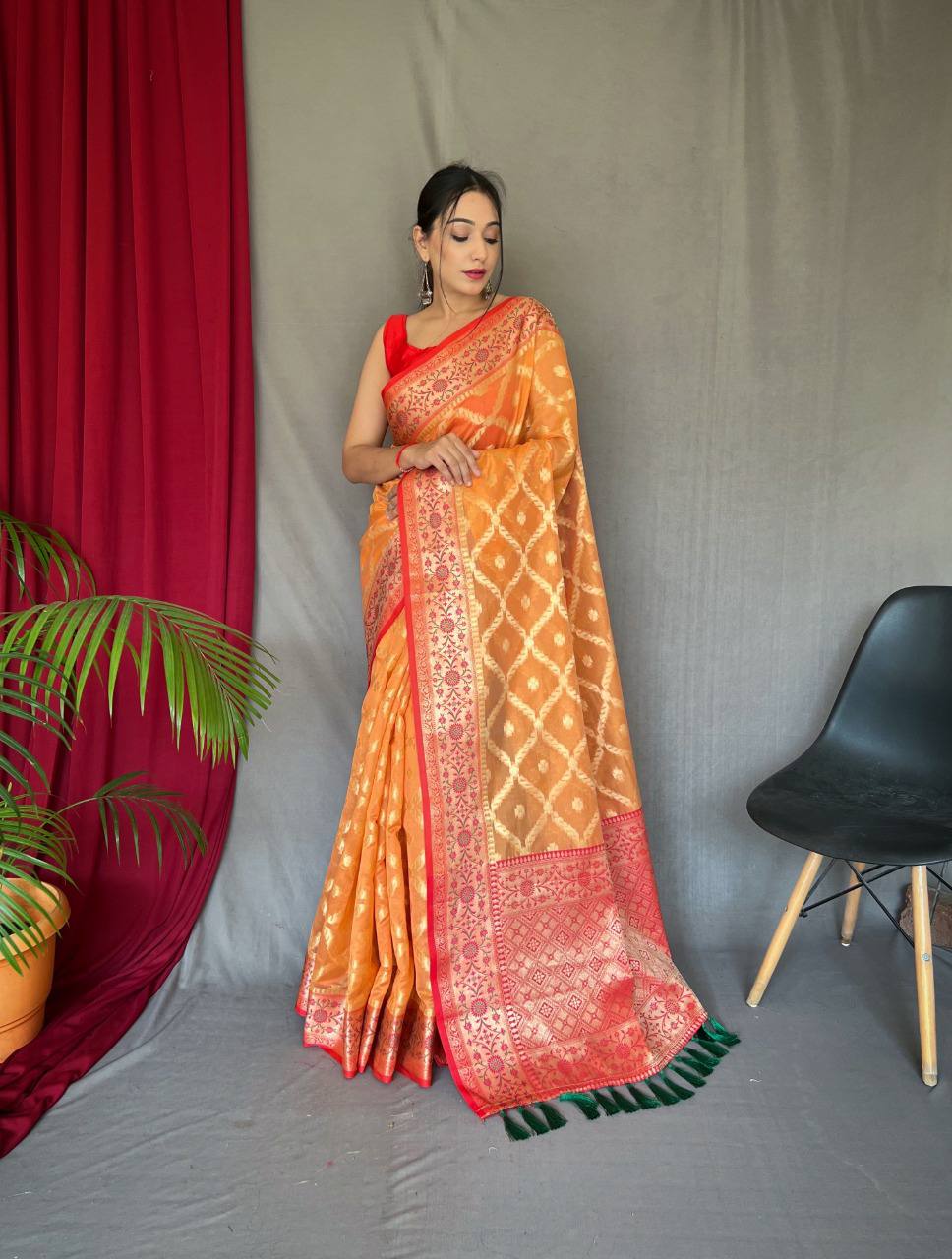 Orange Pure organza weaved saree with Jacquard border.